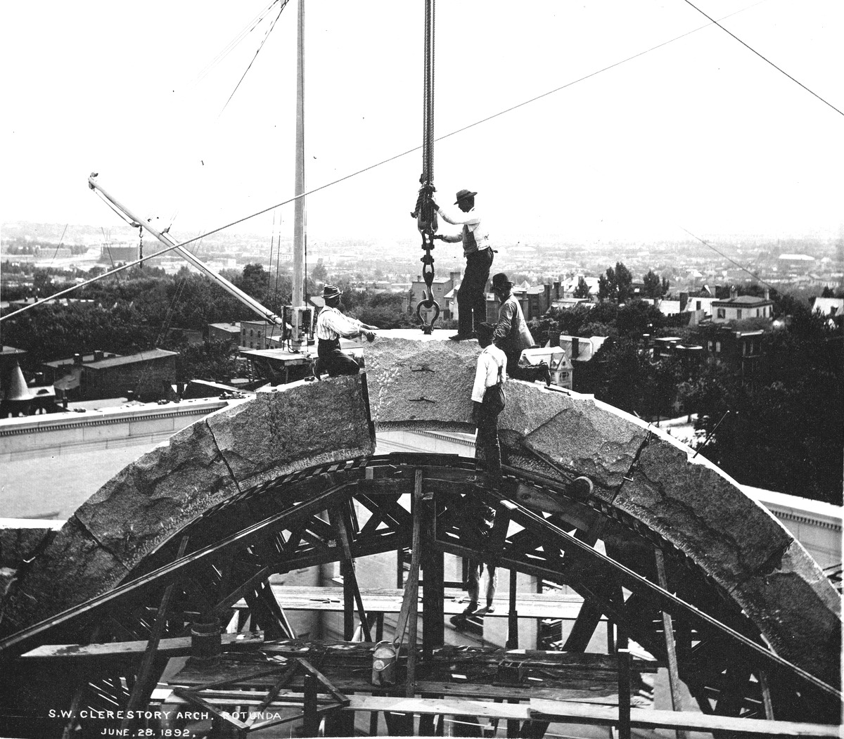 Construction workers setting the keystone of a clerestory arch during construction of the Library of Congress Thomas Jefferson Building, Washington D.C., 1892. Photo by Levin C. Handy, Library of Congress.
